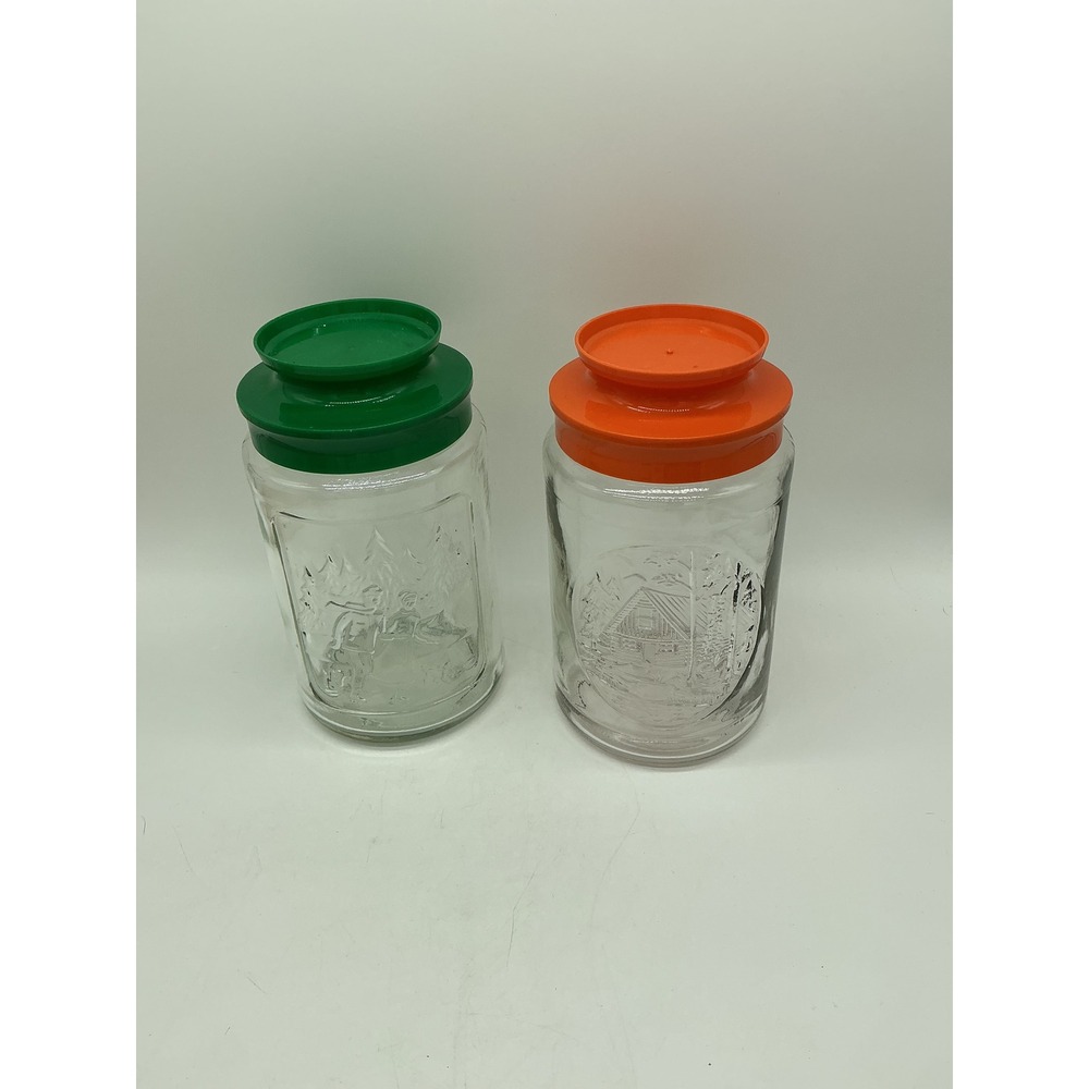 Vintage Winter Cabin Glass Canister Set of 2 Orange Green Lids Embossed Jars